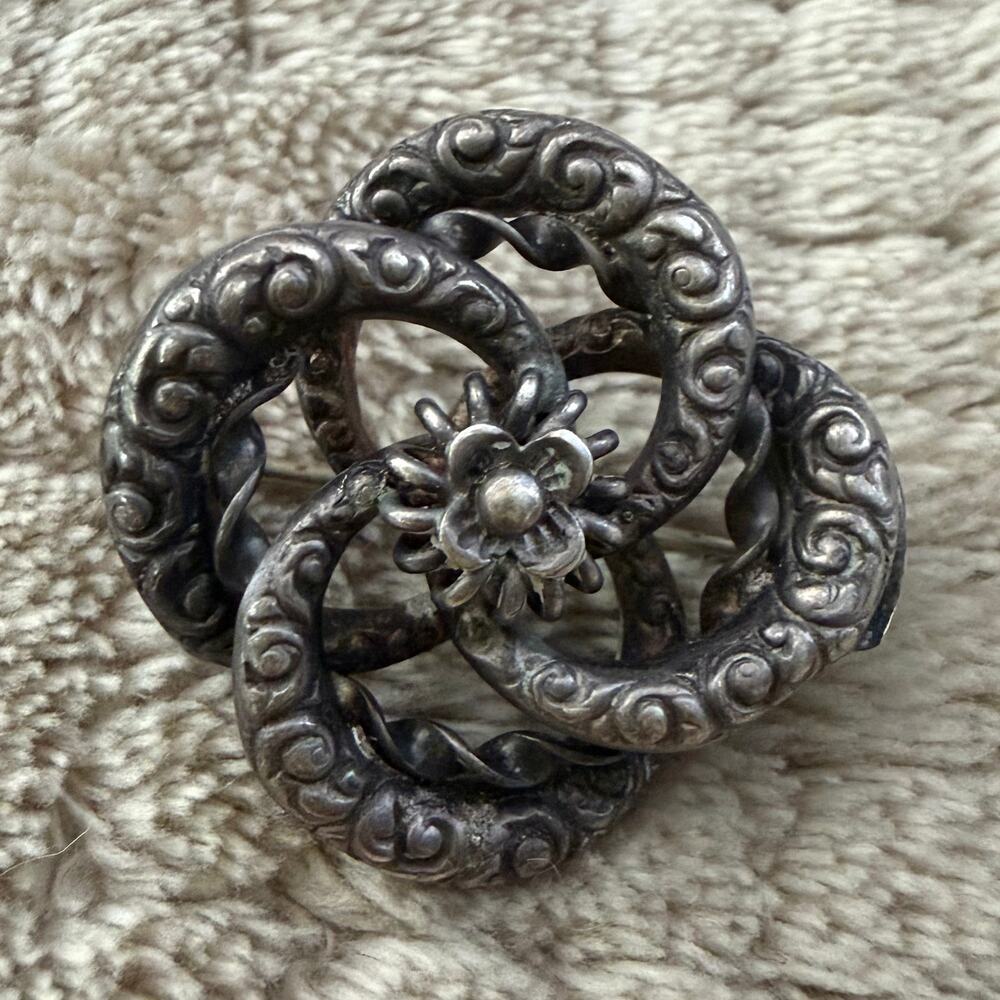 Victorian Sterling Silver Floral Repoussé Lovers Knot Pinwheel Antique Brooch - Picture 1 of 4